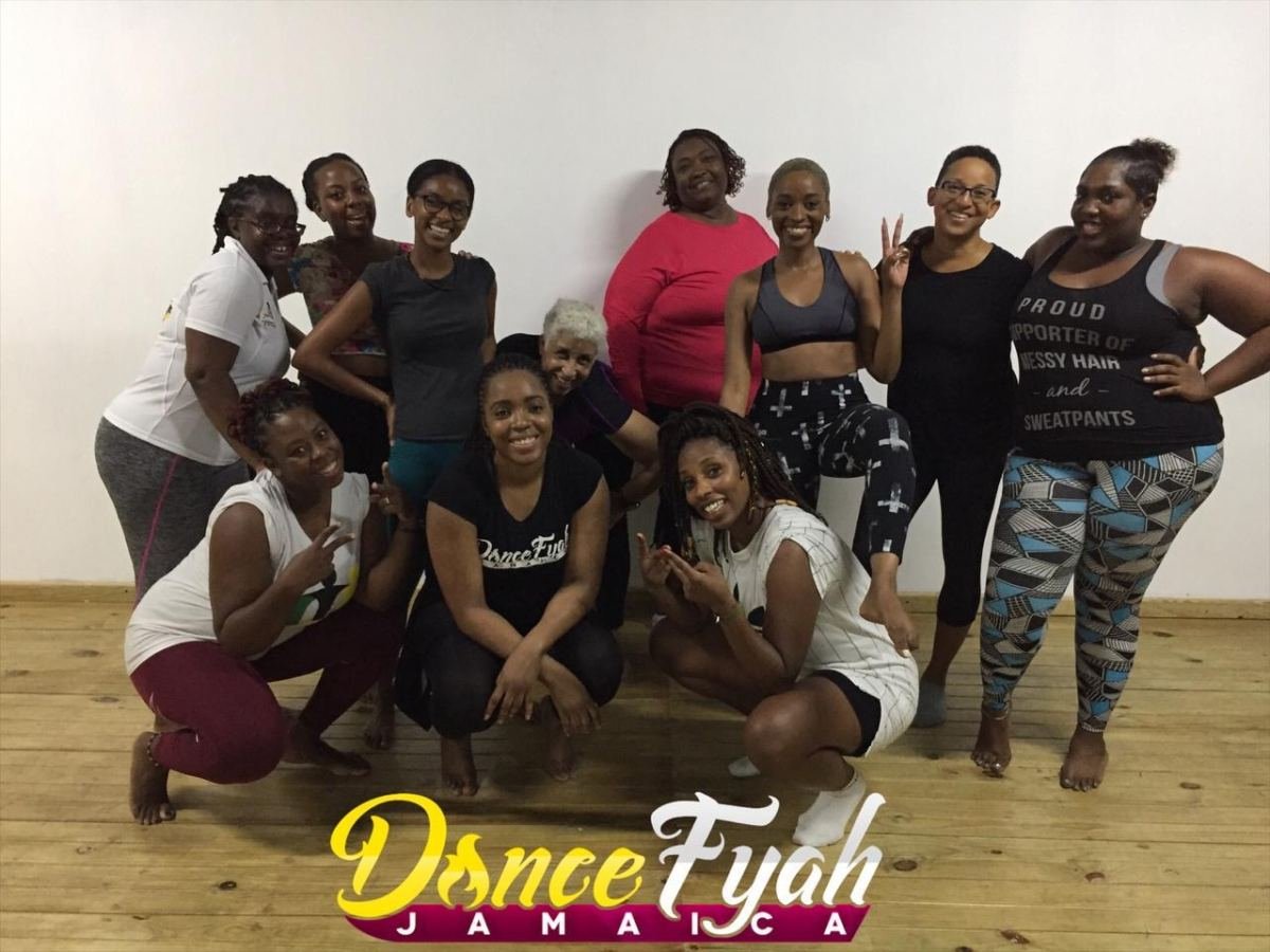 A DanceFyah Jamaica workshop group together in a dance studio