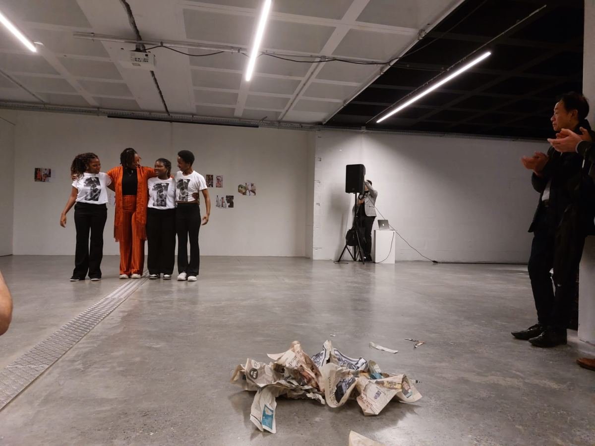 Performers in a gallery space during a live performance